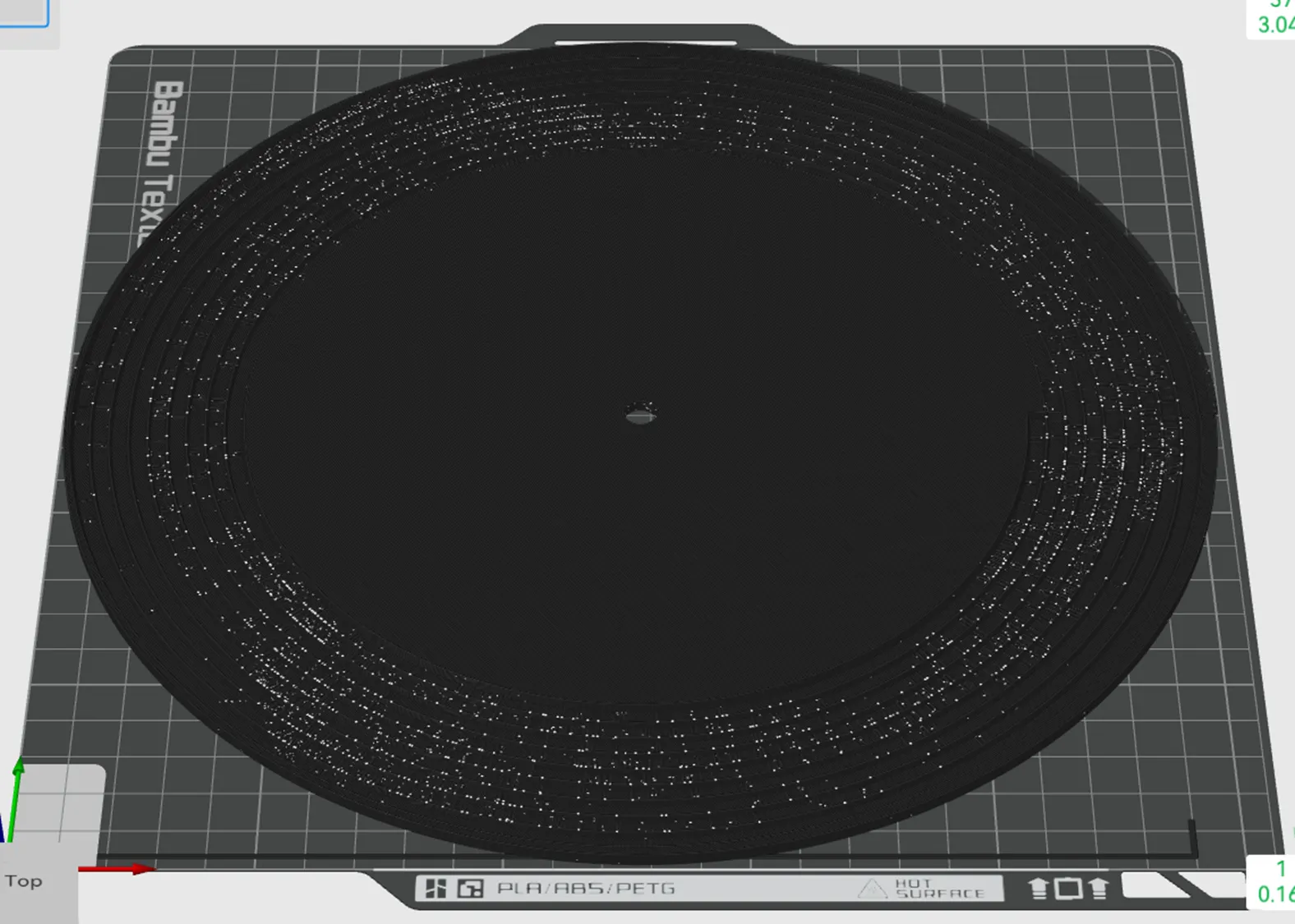 The sliced disc on the build plate: nine grooves on the outer band, a flat centre, 3.04 mm tall