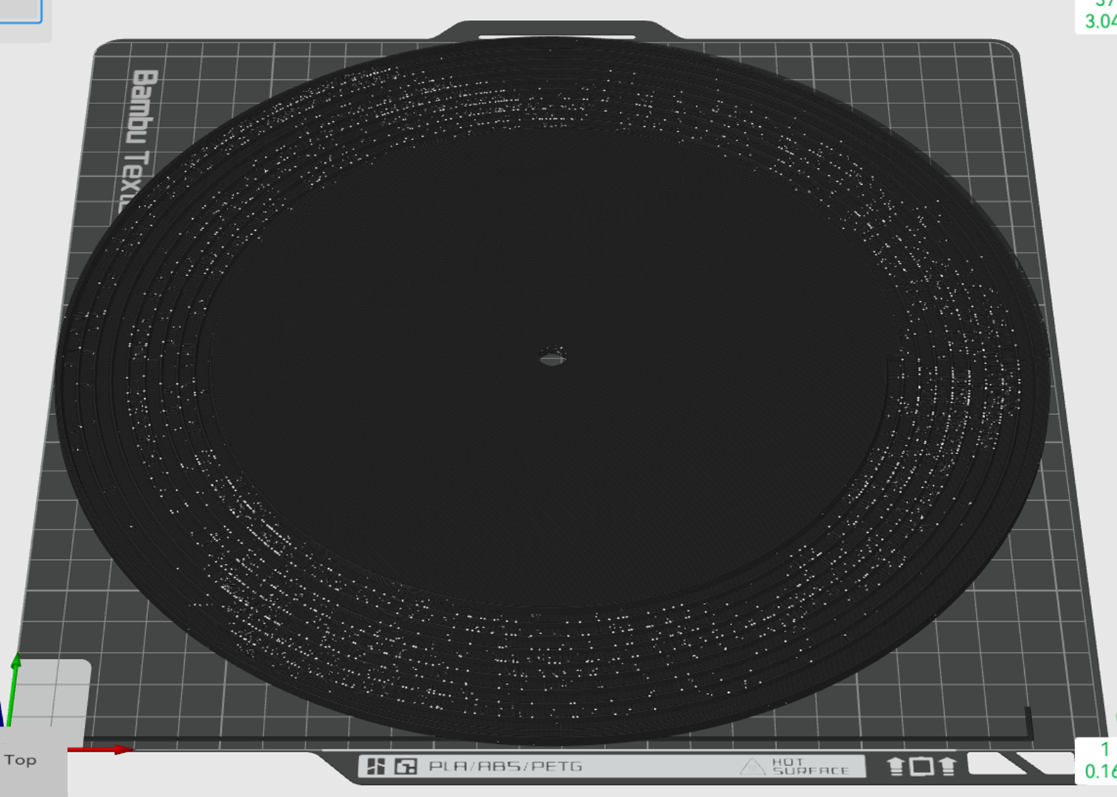 The sliced disc on the build plate: nine grooves on the outer band, a flat centre, 3.04 mm tall